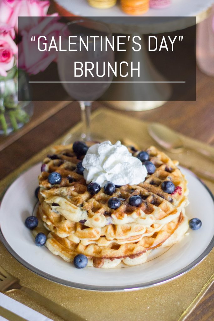 LOVE this idea! "Galentine's Day" was introduced on the show Parks and Recreation. The main character, Leslie Knope, hosts a brunch for her gal pals every year the day before Valentine's Day. Waffles are her favorite food, so this Galentine's Day brunch featuring blueberry waffles is perfect!