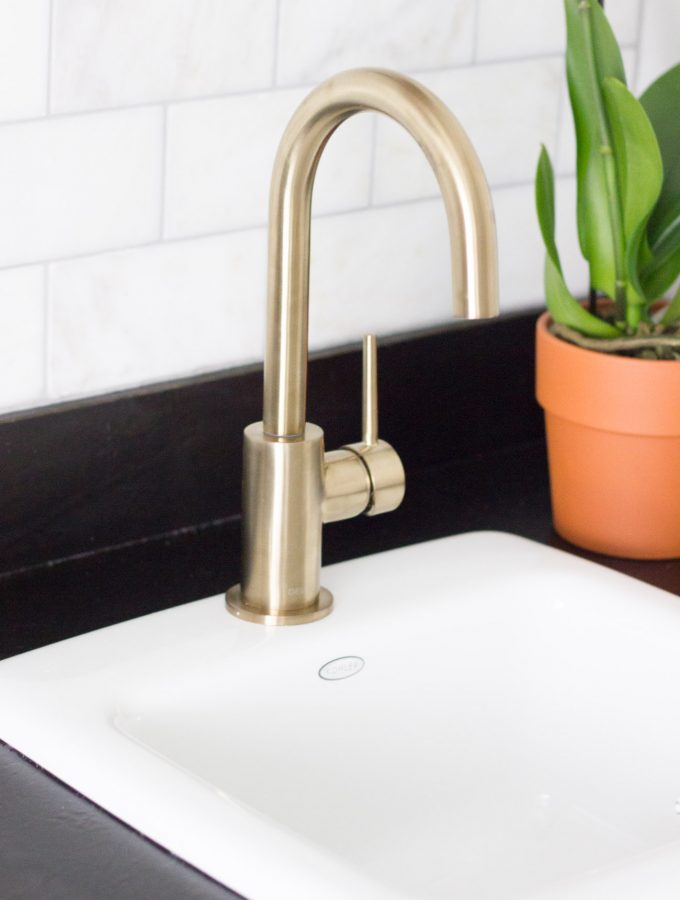 This coffee bar features the Delta Trinsic Bar Prep Faucet in Champagne Bronze, and it is gorgeous!