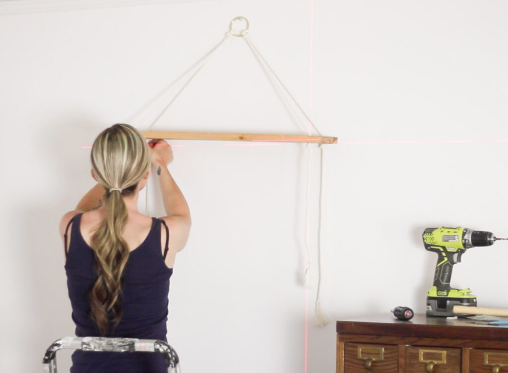 Learn how to make these DIY hanging rope wall shelves, plus see what tools were used to make it easy to hang them straight and level!