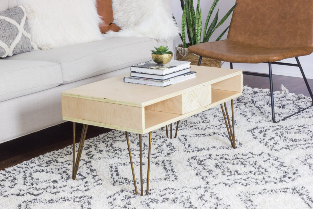 Learn how to make a DIY plywood coffee table with diamond patterned plywood panels that attach with magnets and reveal hidden storage!