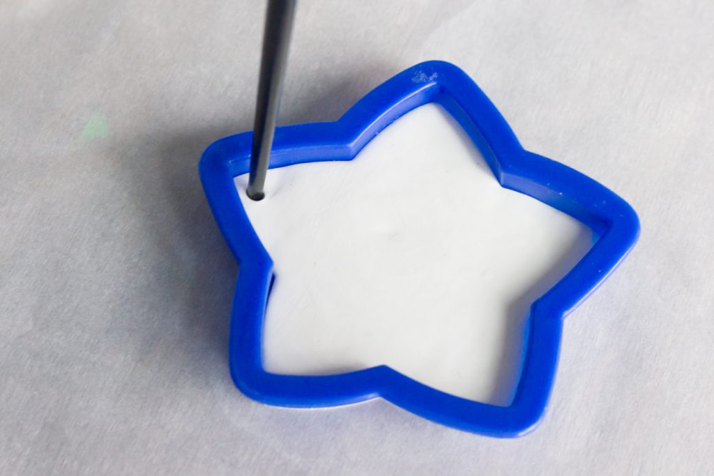 Learn how to make DIY sparkly star ornaments out of polymer clay!
