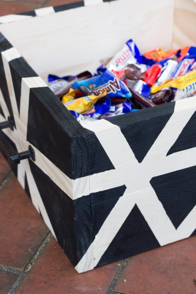 Learn how to make a DIY wooden Halloween candy bin with an abstract design!
