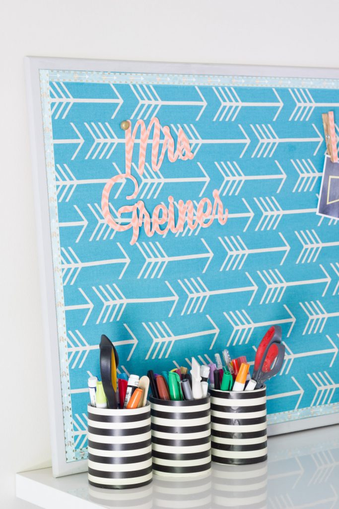 Make this Mod Podge Fabric Bulletin Board (and cute DIY thumb tacks)! It's the perfect classroom gift for your favorite teacher.